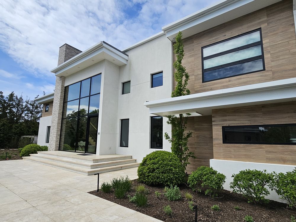 Contemporary residence with full-height black-framed glazing treated by Pellikal
